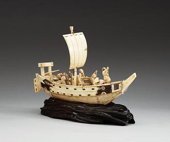 A Japanese ivory model of a ship with fishermen, Meiji period ca 1900.