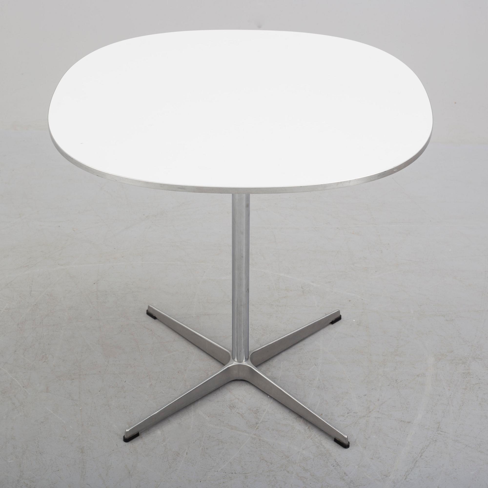 A 'Supercirkel' table by Bruno Mathsson & Piet Hein, Denmark, 1978.