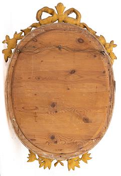 A Gustavian style mirror, early 20th century.