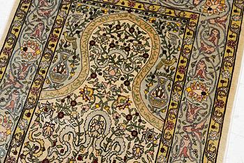 A silk Hereke rug, Turkey, approx. 82 x 58 cm.