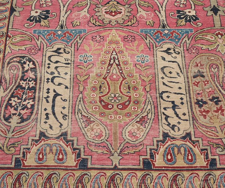 A CARPET, an antique Kerman Laver, ca 363 x 301 cm.