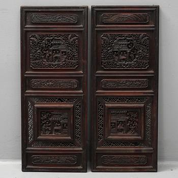 Two Chinese wooden carved panels, 20th century.