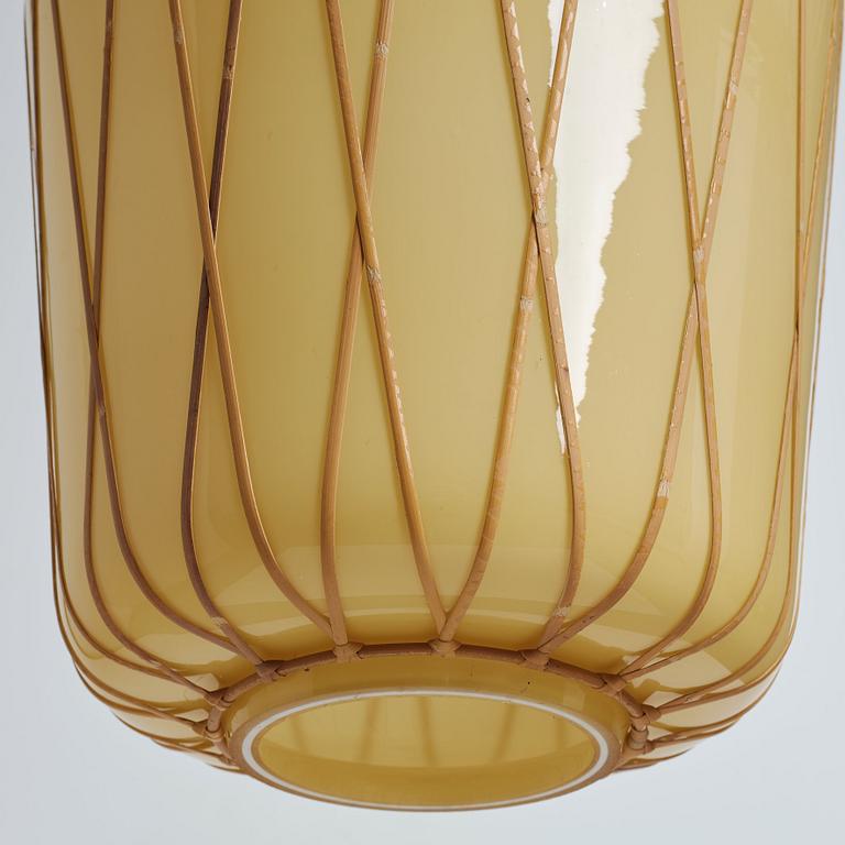 A pair of Swedish vanilla coloured glass ceiling lights with fretted rattan, 1930-40's.