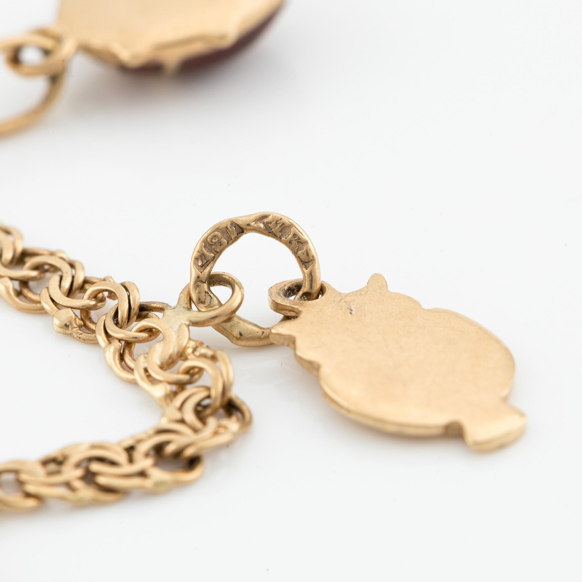 Armband, 18K guld, med berlocker.