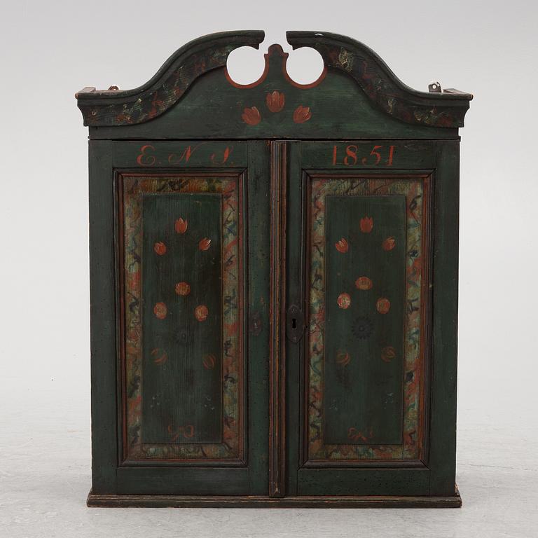 A wall-hanged cabinet, Sweden, dated 1851.