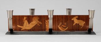 LJUSSTAKE, Mjölby Intarsia, 1900-talets första hälft.