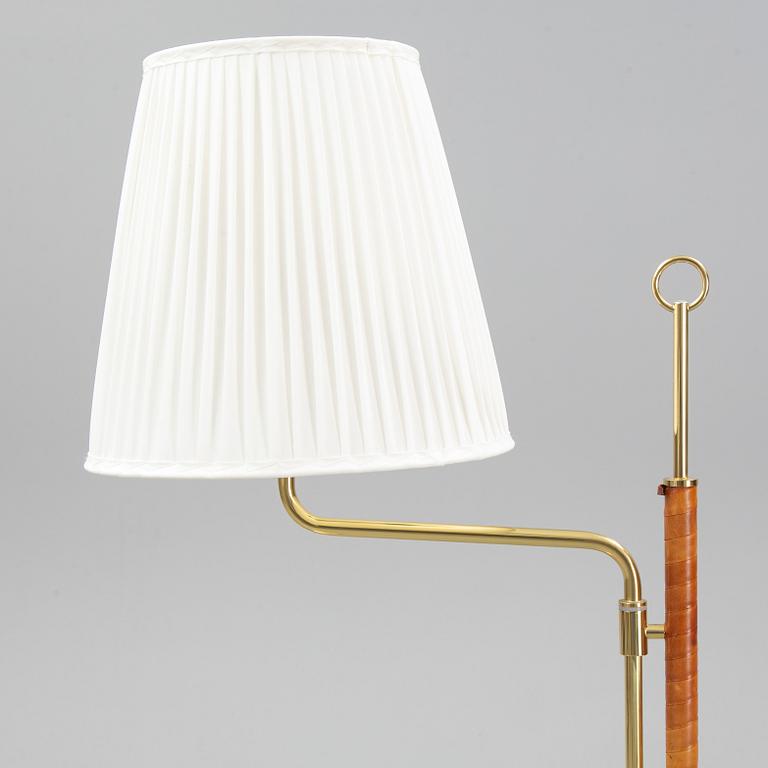 A pair of brass and leather floor lights, Örsjö Industri, 21st century.