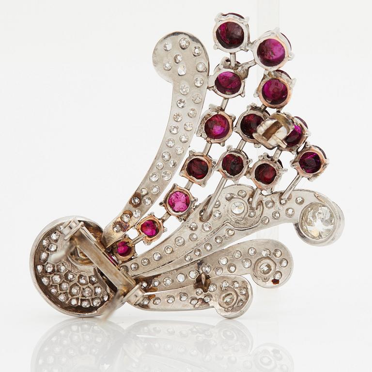 A brooch set with old-cut diamonds with a total weight of ca 2.50 cts and cabochon-cut rubies.