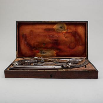 A pair of mid 19th century percussion pistols in a case marked Campagnac a Bordeaux.