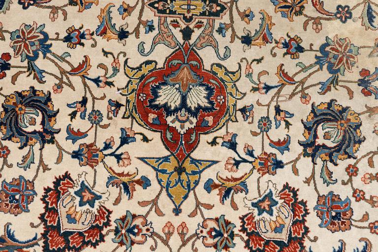 A carpet, semi-antique Tabriz, ca 379 x 280 cm.