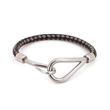 183. HERMÈS, a grey and black leather braclet, "Jumbo".