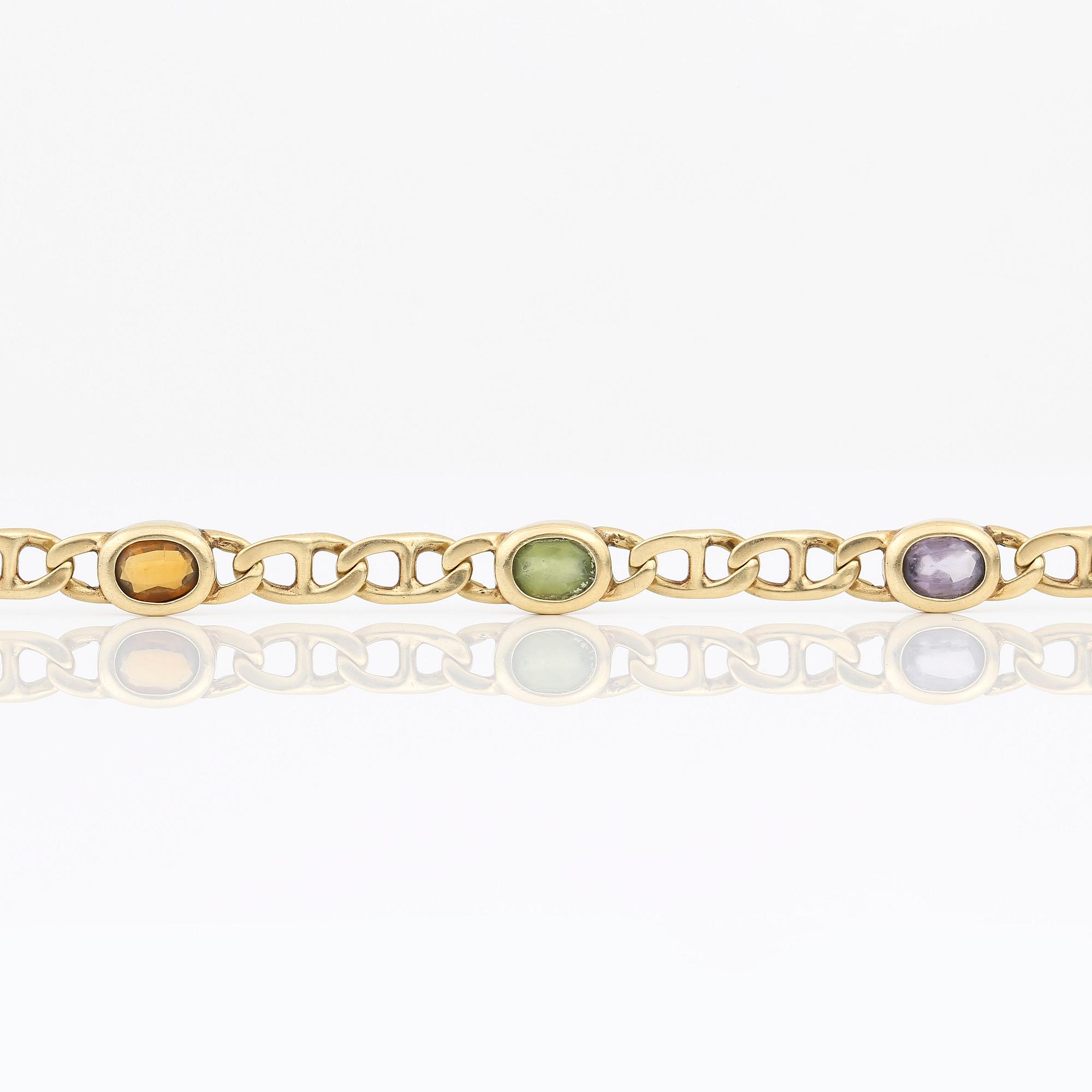 ARMBAND, 14K guld med olikfärgade stenar, sannolikt ametister, citriner och peridoter, Italien. Vikt 12,89 gram.