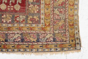 An oriental carpet, c. 195 x 70 cm.