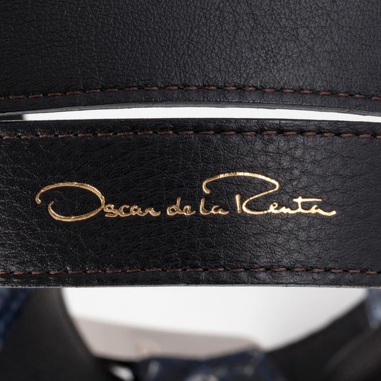 OSCAR DE LA RENTA, a blue snakeskin belt.