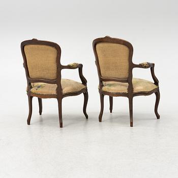 A pair of Rococo style armchairs, around 1900.