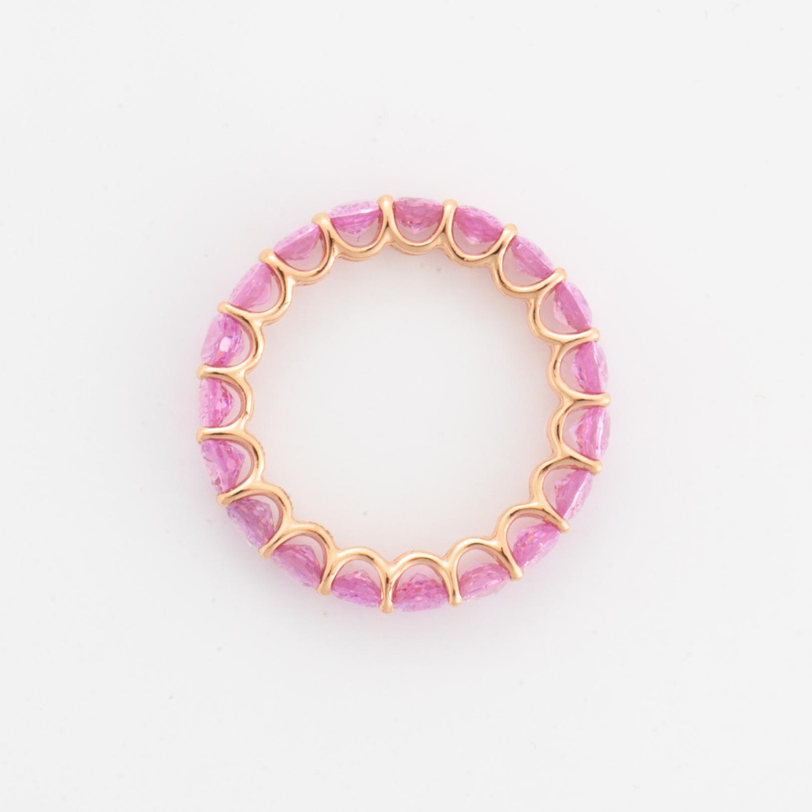 Oval faceted pink sapphire ring.