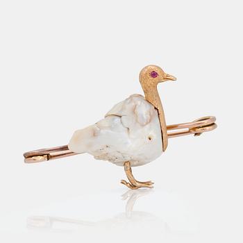 1006. A baroque natural pearl brooch with rubies in the shape of a bird. Ca 1860's.