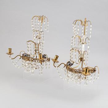 A pair of brass wall sconces, first half of the 20th century.