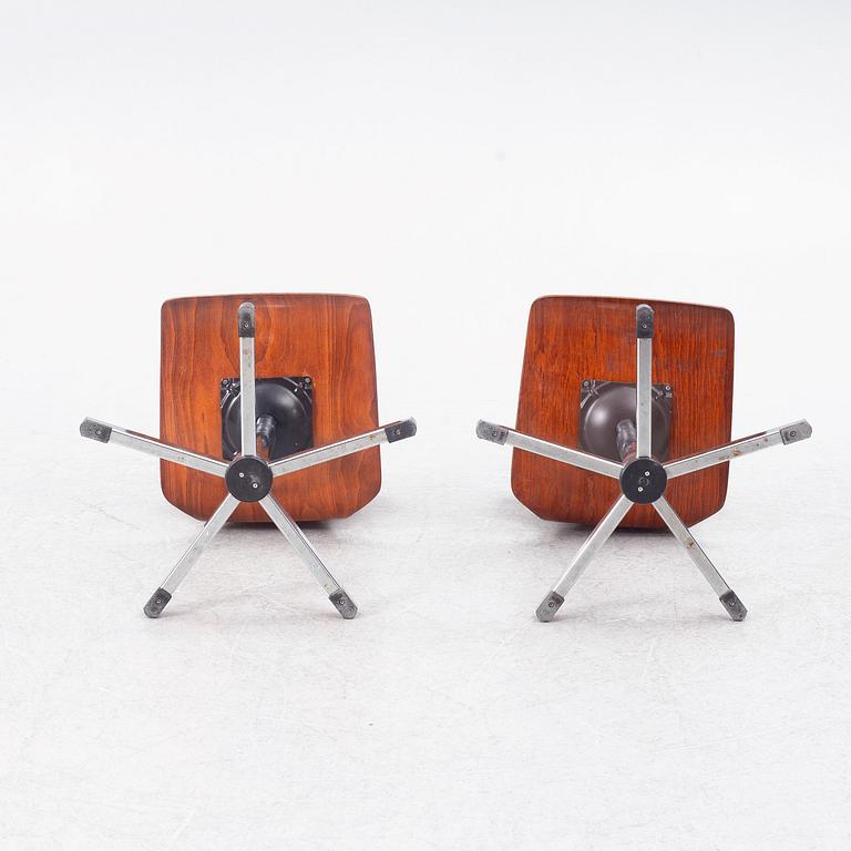 A pair of swivel chairs, contemporary.