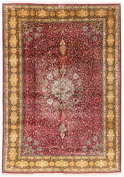 An oriental silk rug, approximately 258 x 178 cm.