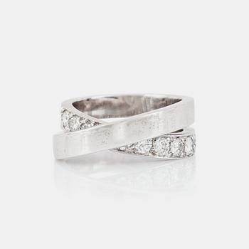 1176. A brilliant-cut diamond ring, signed Cartier.