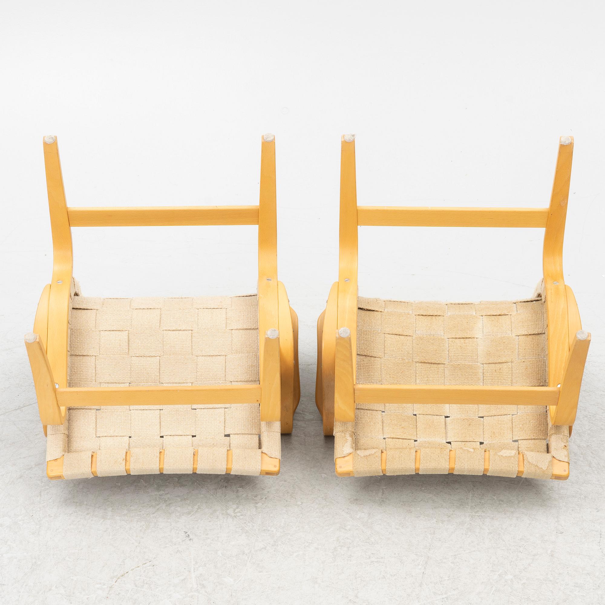 Bruno Mathsson, a pair of 'Eva' armchairs, DUX, Sweden, second half of the 20th century.
