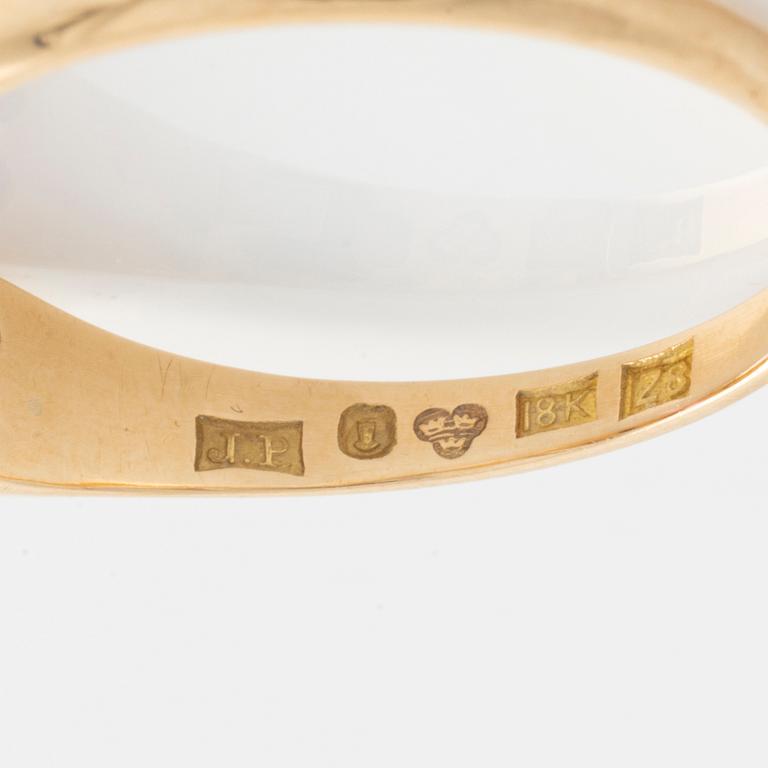 Ring, gold with synthetic pink stone and small white stones.