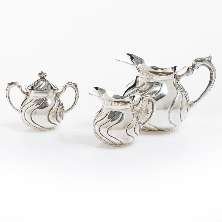 A sterling silver jug, milk jug and sugar bowl, possibly Mexico, mid20th century.