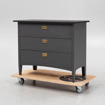 A painted chest of drawers, circa 1900.