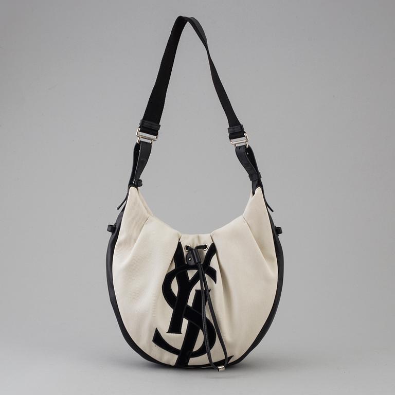 A vwite and black monogram hobobag by Yves Saint Laurent.