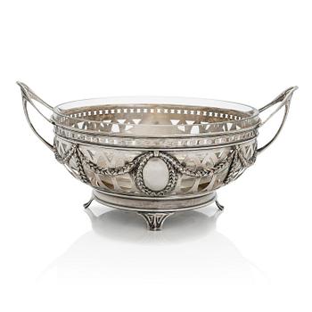 A silver serving bowl with glass liner, import mark of 1899-1907, stamped Br. Grachev's with court supplier's mark.