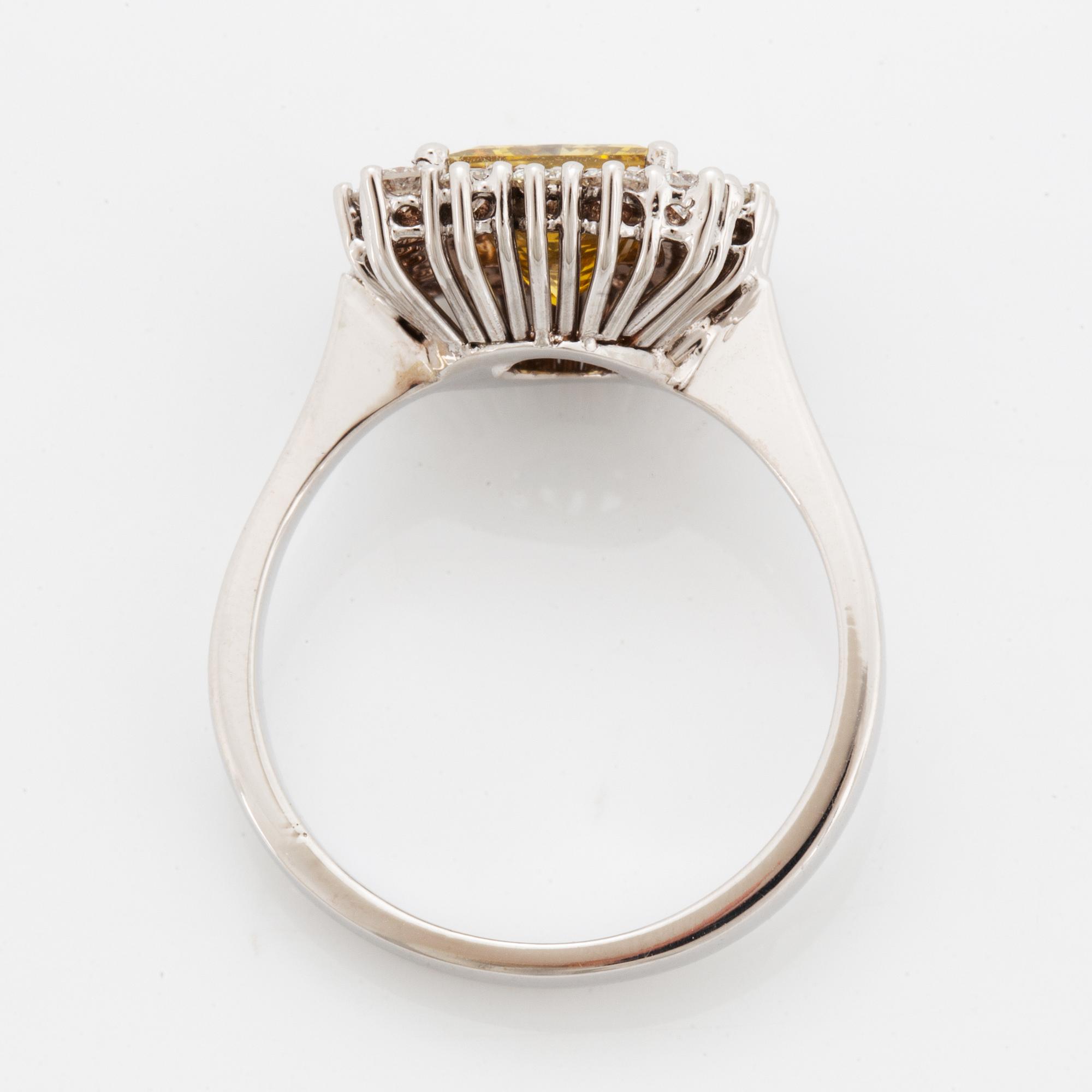 Princess-cut colour treated fancy deep brown-yellow diamond ring.