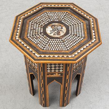 A mother of pearl and wood small table, 20th century.