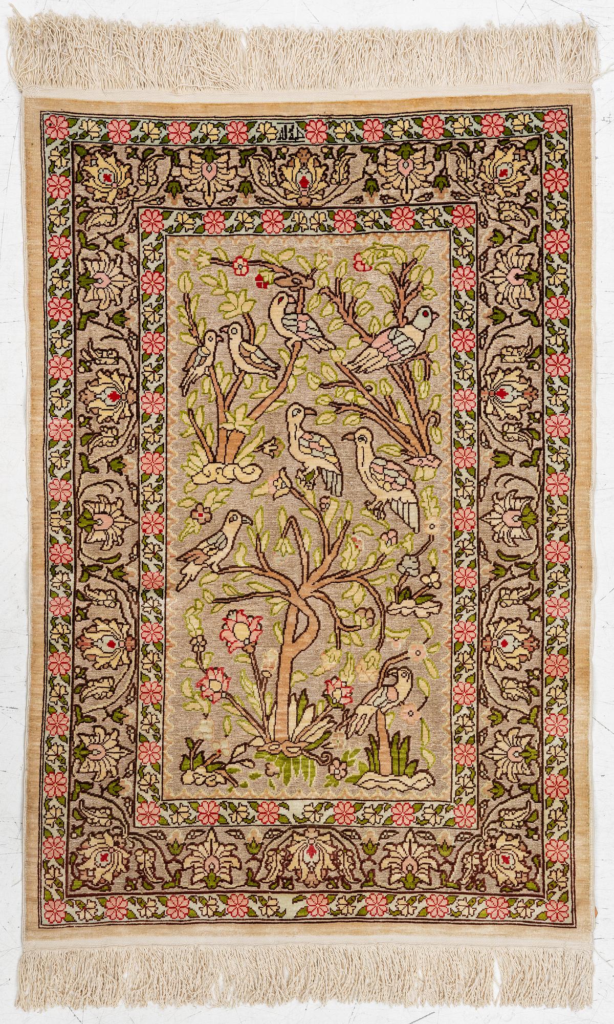 A silk an metal Hereke rug, West Anatolia, c. 100 x 68 cm.