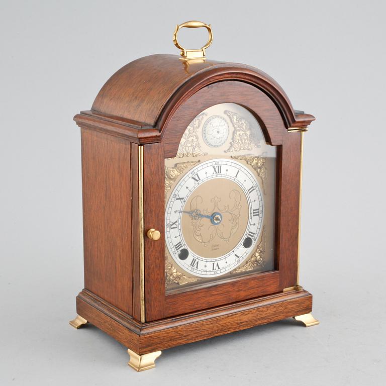 A table ckock by Elliot from London in the 20th century.