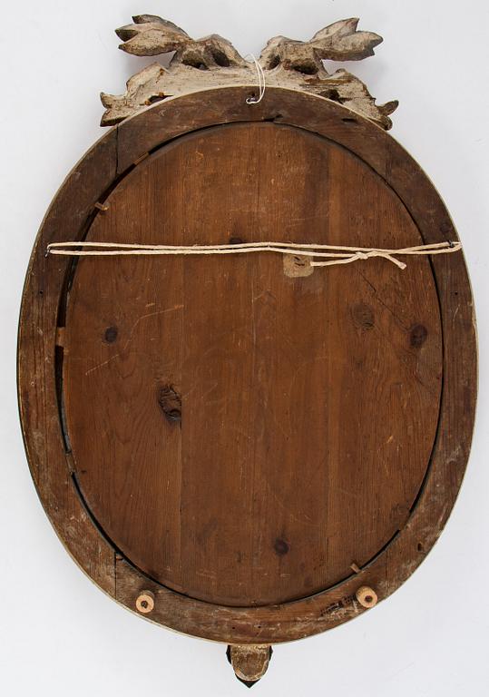 A Gustavian two-light girandole mirror, Stockholm, late 18th century.