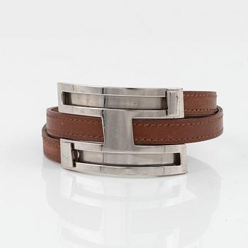 Hermès, a brown leather and palladium metal 'Pousse Pousse' bracelet.