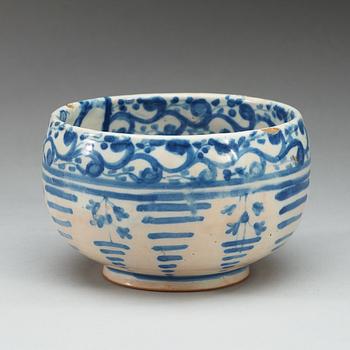 A Spanish faience blue and white bowl. Marked Talavera, presumably 18th Century.