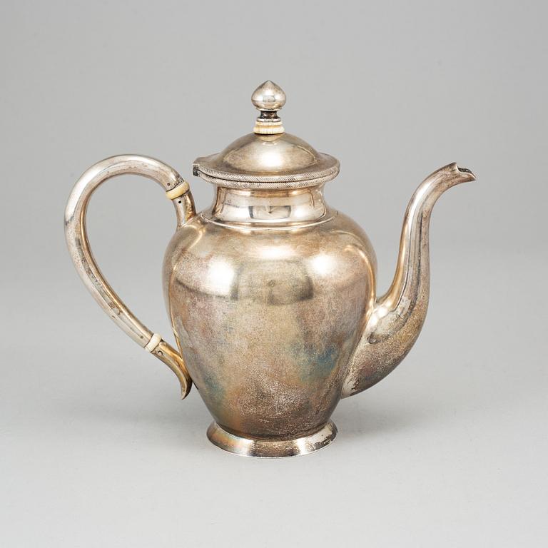 A Russian parcel-gilt silver coffee pot, unidentified makers mark, St. Petersburg 1886.