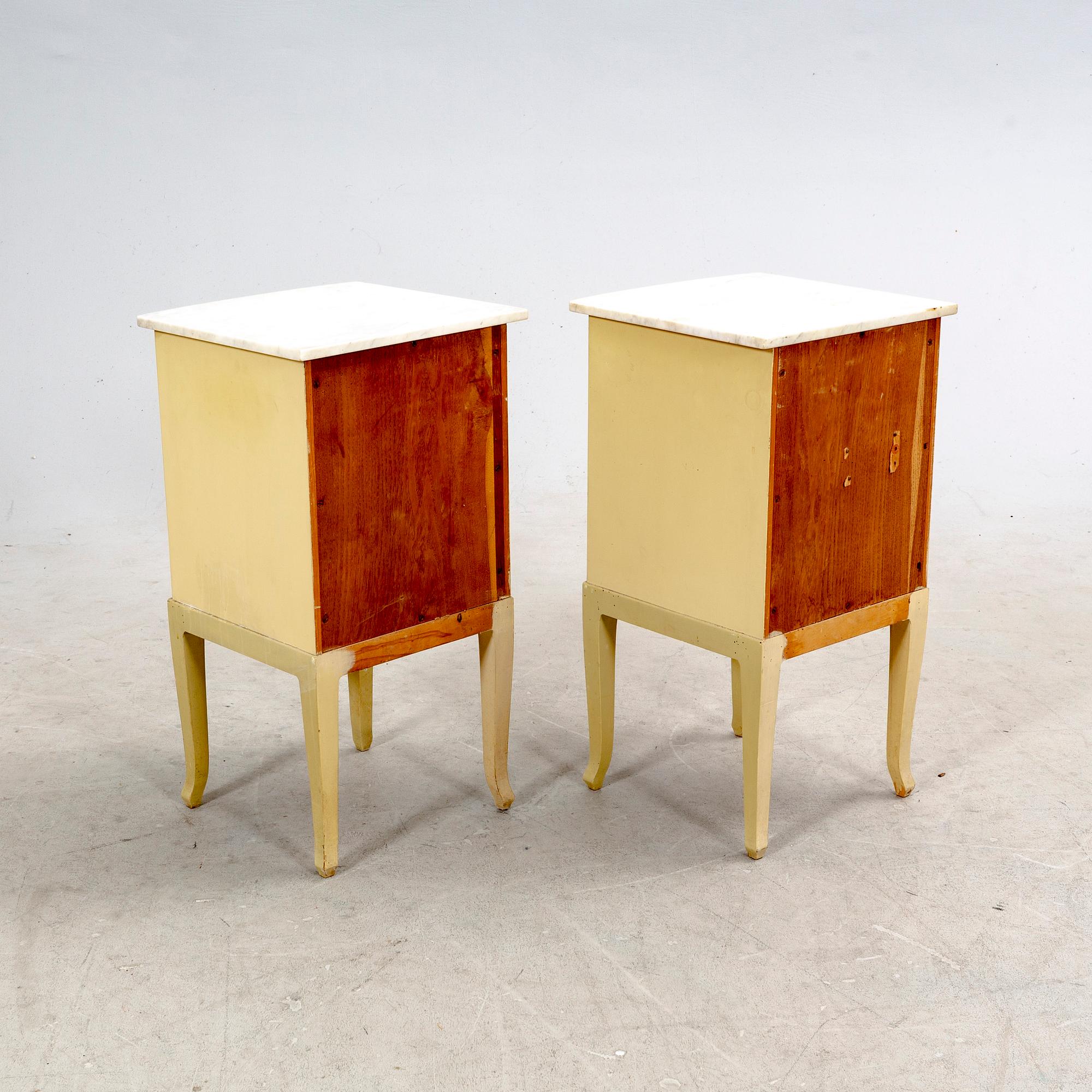 A pair of painted bedside tables first half of the 20th century.