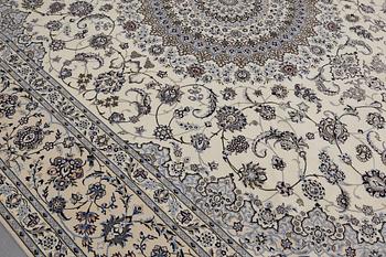 A Nain part silk carpet, 408 x 308 cm.