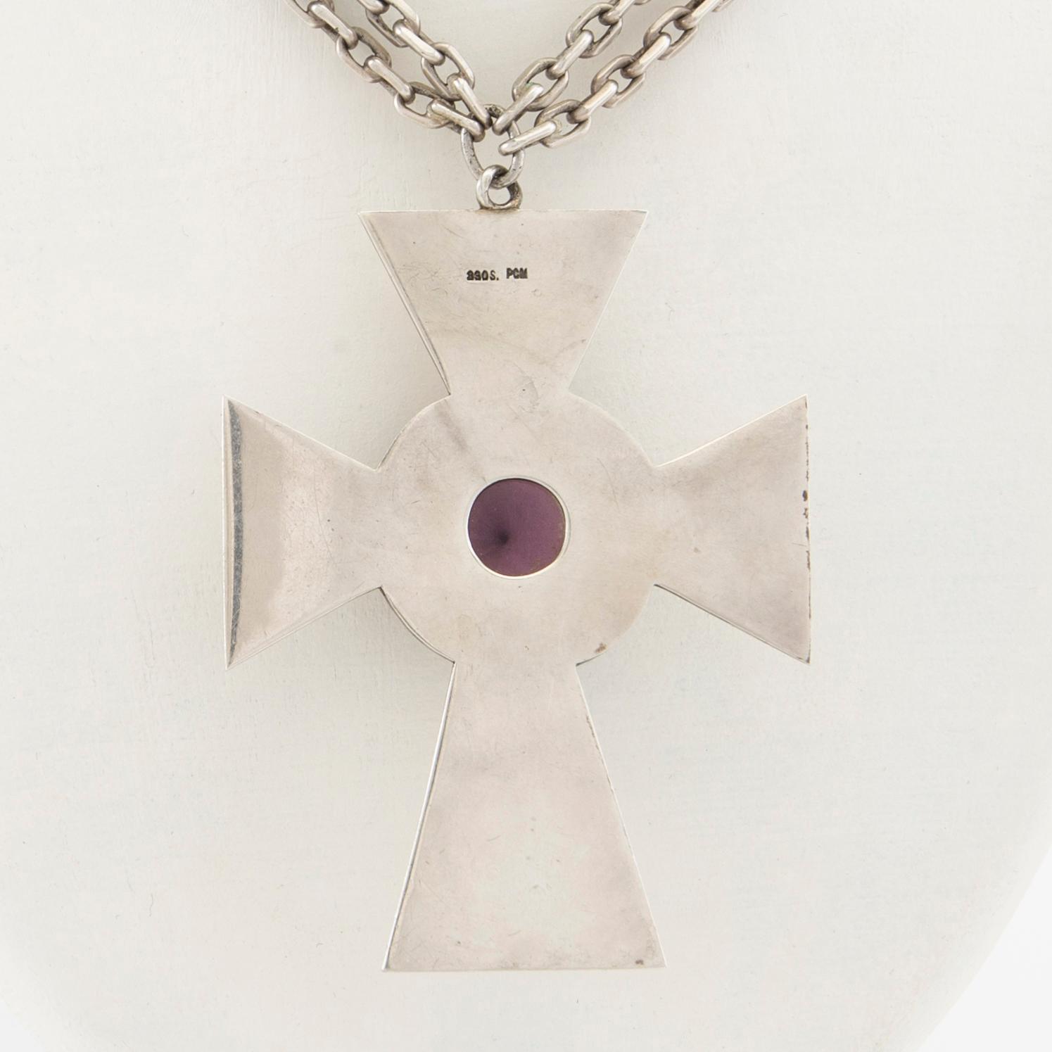 Necklace of silver in the form of a cross with faceted glass.