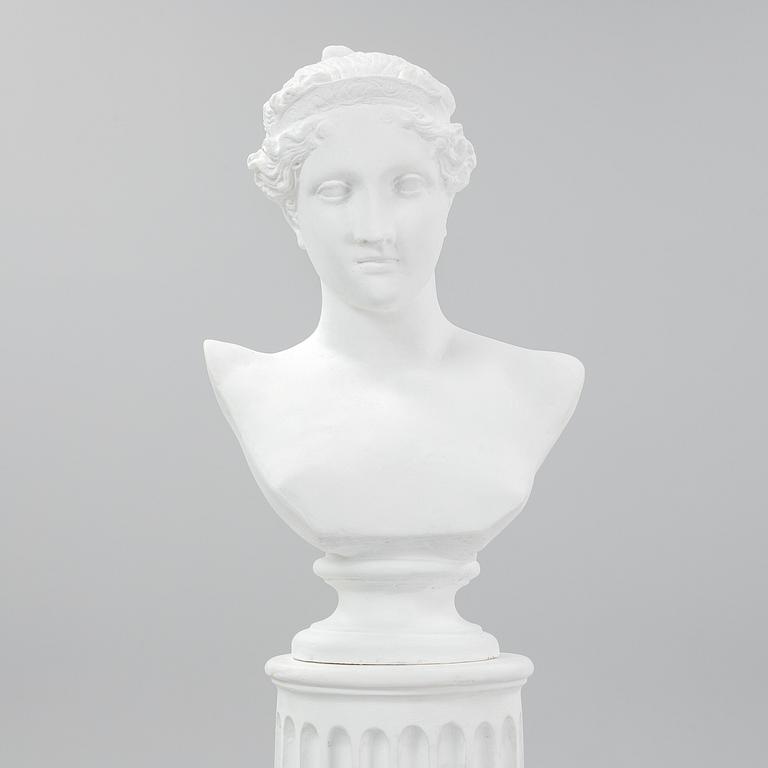 A plaster bust and pedestal.