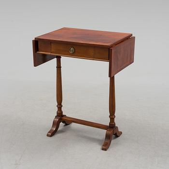 A Swedish first half of the century Karl Johan style mahogany veneered table.