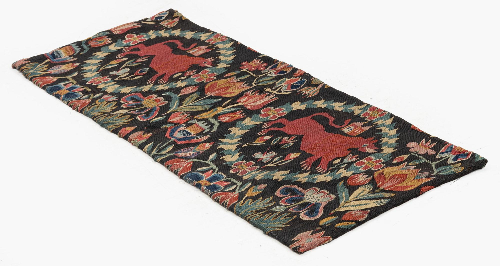 A cushion, 'Red Lion' (Rött Lejon), tapestry weave, ca 86 x 36 cm, southwestern Scania, first part of the 19th century.