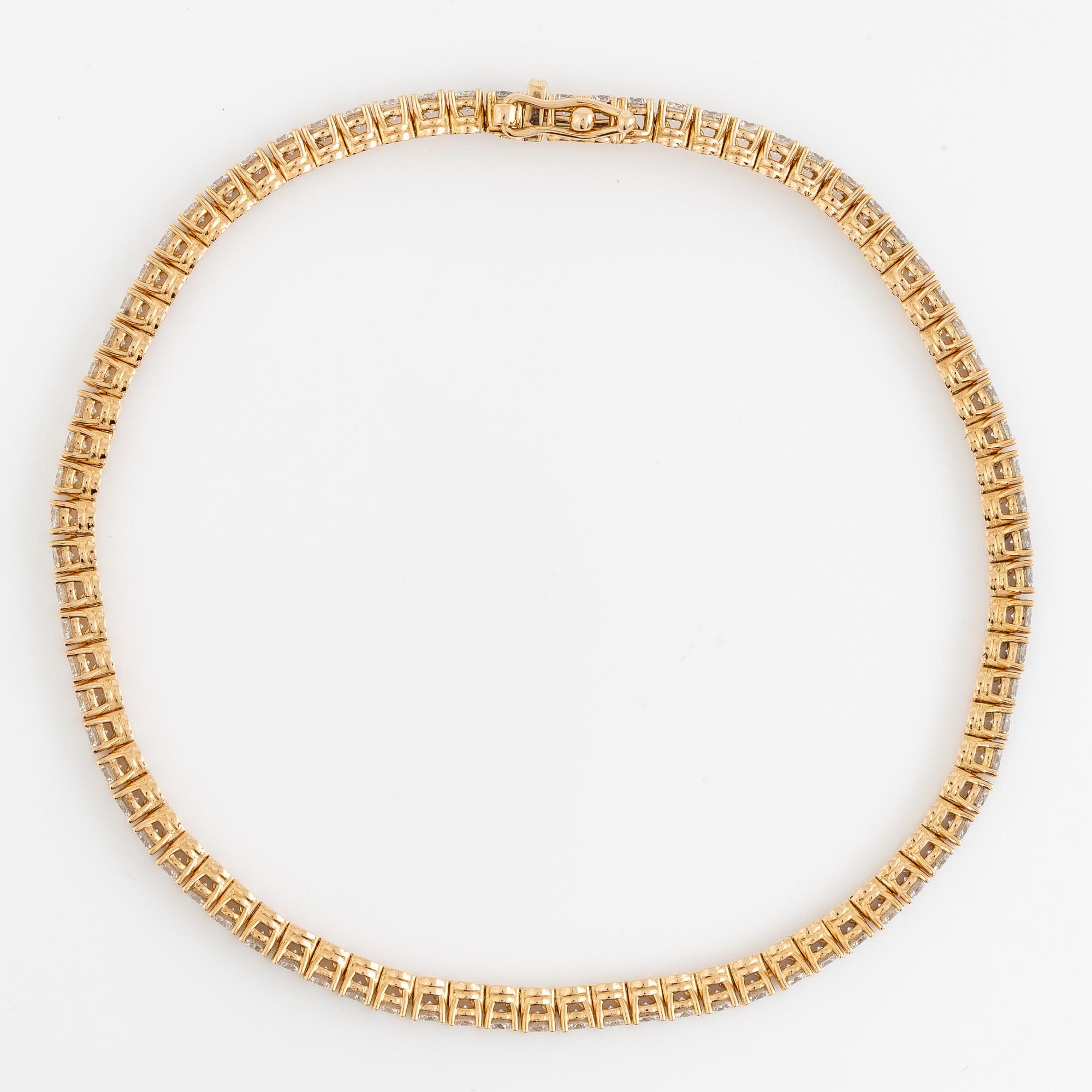 Tennisarmband 18K guld med briljantslipade diamanter.