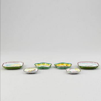 A set of tree chinese boxes with cover, and 6 dishes, enamel on copper, China, early 20th Century.