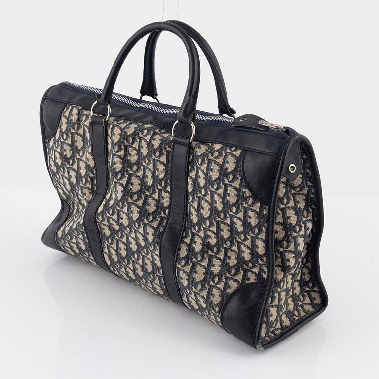 Christian Dior, a handbag, wallet, and coin purse.