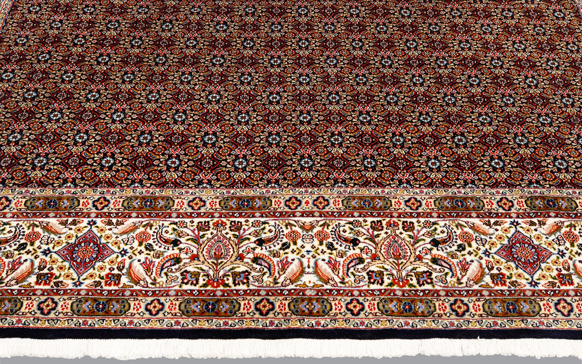 A Moud part silk carpet, signed, 335 x 250 cm.