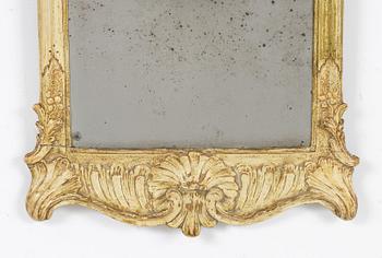 A giltwood rococo mirror, Stockholm, mid 18th century.